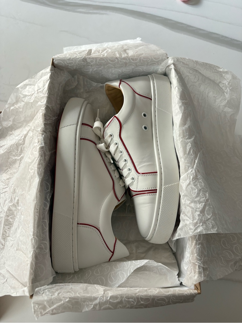White Christian Louboutin sneakers